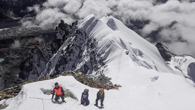 Myanmar mountaineers ascend Ama Dablam mountain in Nepal, in preparation for an expedition to Hkakabo Razi on the northern tip of Myanmar near the border with China and India. A two-week jungle trek followed by a sheer climb up avalanche-prone slopes to a jagged ridge of icy pinnacles awaits three men planning to take on this peak so treacherous it has only been conquered once. (Hkakabo Razi Expedition 2018 / AFP) Myanmar mountaineers ascend Ama Dablam mountain in Nepal, in preparation for an expedition to Hkakabo Razi on the northern tip of Myanmar near the border with China and India. A two-week jungle trek followed by a sheer climb up avalanche-prone slopes to a jagged ridge of icy pinnacles awaits three men planning to take on this peak so treacherous it has only been conquered once. (Hkakabo Razi Expedition 2018 / AFP)