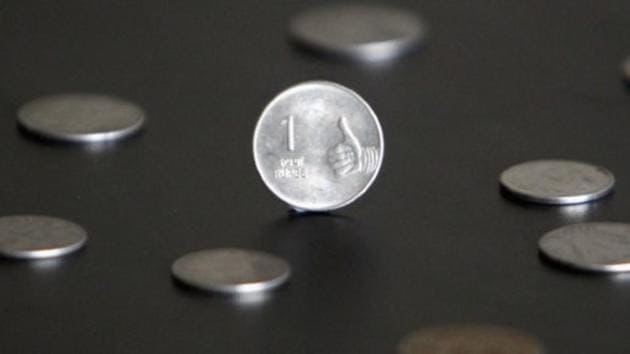 A rupee coin is seen in this picture illustration taken in Mumbai April 30, 2012. REUTERS/Vivek Prakash/Files (Reuters File Photo) A rupee coin is seen in this picture illustration taken in Mumbai April 30, 2012. REUTERS/Vivek Prakash/Files (Reuters File Photo)
