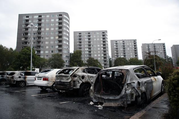Burned cars parked at Frolunda Square in Gothenburg on Tuesday. Masked youth torched dozens of cars overnight in Sweden and threw rocks at police, prompting an angry response from the prime minister, who on Tuesday spoke of an "extremely organized" night of vandalism. (AP Photo) Burned cars parked at Frolunda Square in Gothenburg on Tuesday. Masked youth torched dozens of cars overnight in Sweden and threw rocks at police, prompting an angry response from the prime minister, who on Tuesday spoke of an "extremely organized" night of vandalism. (AP Photo)