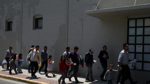 Undocumented immigrant families walk from a bus depot to a respite centre after being released from detention in McAllen, Texas. (Reuters file photo) Undocumented immigrant families walk from a bus depot to a respite centre after being released from detention in McAllen, Texas. (Reuters file photo)