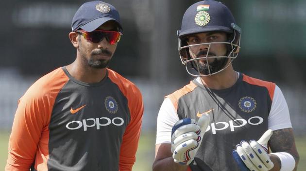 Jasprit Bumrah, left, speaks to his captain Virat Kohli during a training session at Lord's Cricket ground in London.(AP)