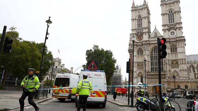 Police officers stand at a cordon after a car crashed outside the Houses of Parliament in Westminster, London, Britain, on Tuesday. (Reuters photo) Police officers stand at a cordon after a car crashed outside the Houses of Parliament in Westminster, London, Britain, on Tuesday. (Reuters photo)