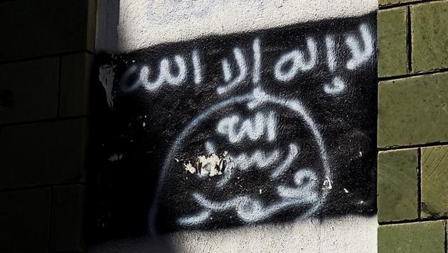 The black Al-Qaeda flag is sprayed on the wall of a damaged school in Taiz, Yemen on October 16, 2017. (AP File Photo) The black Al-Qaeda flag is sprayed on the wall of a damaged school in Taiz, Yemen on October 16, 2017. (AP File Photo)