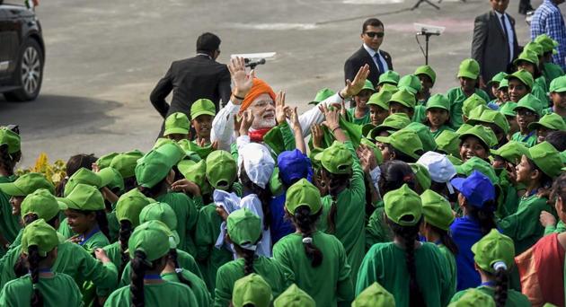 Prime Minister Narendra Modi interacts with children during Independence Day celebrations at the Red Fort, in New Delhi on August 15. (PTI Photo) Prime Minister Narendra Modi interacts with children during Independence Day celebrations at the Red Fort, in New Delhi on August 15. (PTI Photo)