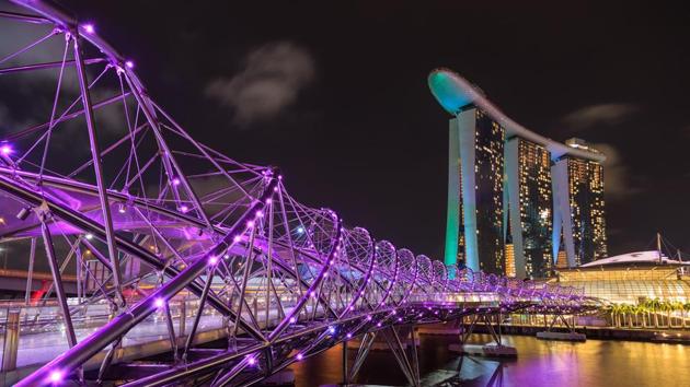 Helix Bridge, Singapore: This bridge across the Singapore river was designed to resemble the structure of the DNA. It is made of steel and is illuminated by LED lighting at night. (Shutterstock) Helix Bridge, Singapore: This bridge across the Singapore river was designed to resemble the structure of the DNA. It is made of steel and is illuminated by LED lighting at night. (Shutterstock)