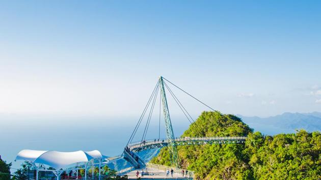 Langkawi Sky Bridge, Malaysia: The 410-sq-feet curved sky bridge is accessed via cable car. It is located 2,300 ft above sea level. It gives you views of some of Malaysian mountains and rainforests. (Shutterstock) Langkawi Sky Bridge, Malaysia: The 410-sq-feet curved sky bridge is accessed via cable car. It is located 2,300 ft above sea level. It gives you views of some of Malaysian mountains and rainforests. (Shutterstock)