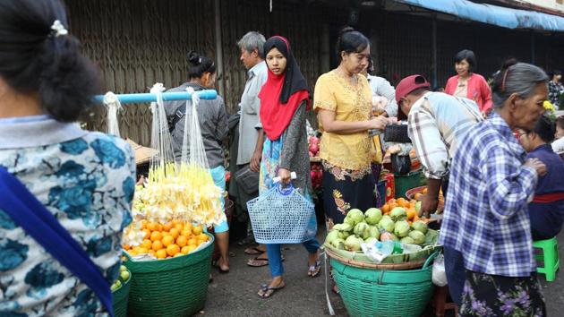 Win Lae Phyu Sin shops for food at a Yangon market. Systematic persecution of Muslims is growing in Myanmar, rights groups say, though world attention has focused on its Rohingya Muslims. But many Muslims of all ethnicities have been refused national identity documents, and denied access to some places of worship, Burma Human Rights Network said last year. (Ann Wang / REUTERS) 