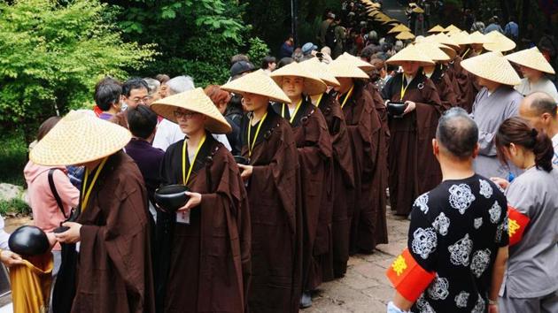 The head of China’s government-run Buddhist association quit his post on Wednesday amid an investigation into allegations that he coerced several nuns into having sex with him. (Representative Image/AFP File Photo) The head of China’s government-run Buddhist association quit his post on Wednesday amid an investigation into allegations that he coerced several nuns into having sex with him. (Representative Image/AFP File Photo)