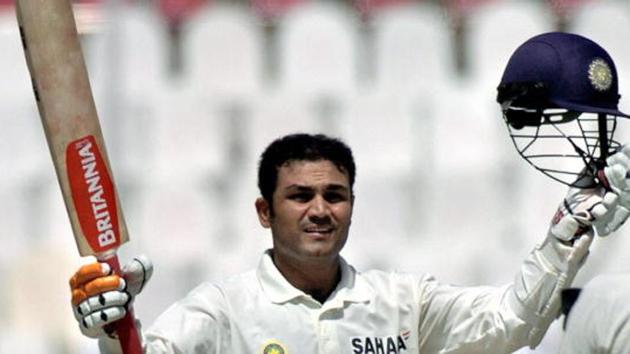 MULTAN, PAKISTAN: Indian batsman Virender Sehwag celebrates after scoring his triple century during the second day of the first Test match between Pakistan and Indian in Multan, 29 March 2004.(AFP/Getty Images)