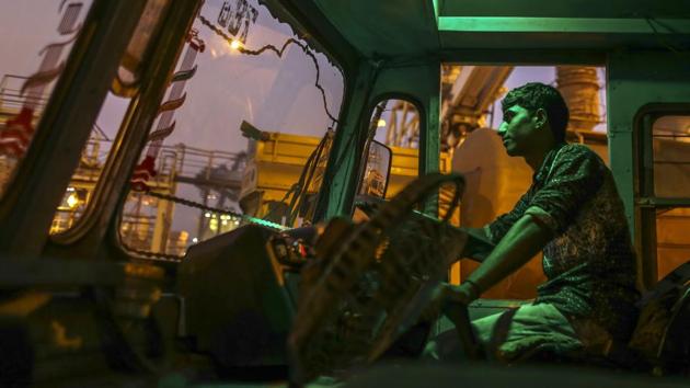 A driver sits inside the cabin of a cement tanker truck at the Jawaharlal Nehru Port, operated by Jawaharlal Nehru Port Trust (JNPT), in Navi Mumbai, Maharashtra.(Dhiraj Singh/Bloomberg)