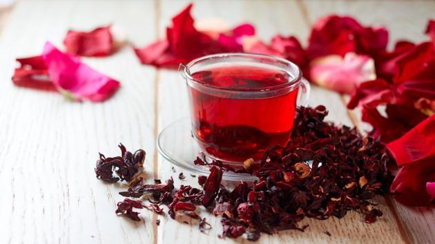 Hibiscus tea is prepared by using the hibiscus plant’s colourful flowers. It has a pinkish colour and can be consumed hot or cold. It could also help in lowering high blood pressure. However, one should be careful about not taking it with some types of diuretic medication or at the same time when having aspirin. (shutterstock) Hibiscus tea is prepared by using the hibiscus plant’s colourful flowers. It has a pinkish colour and can be consumed hot or cold. It could also help in lowering high blood pressure. However, one should be careful about not taking it with some types of diuretic medication or at the same time when having aspirin. (shutterstock)