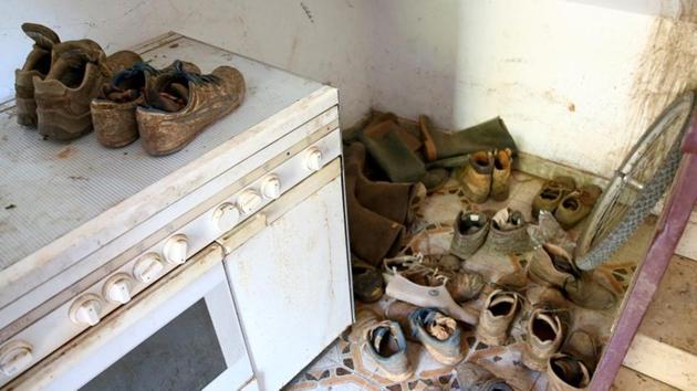 African migrant labourers’ shoes are seen in a shelter near Foggia. Ludovico Vaccaro, the magistrate investigating the August 6 deaths, says rampant exploitation of foreign labourers has gone largely unchecked for years. “They should rebel, but they are so poor they have to accept the unacceptable,” he told Reuters. (Alessandro Bianchi / REUTERS) 