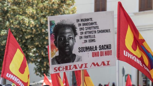 Migrant workers hold a banner in honour of Soumaila Sacko, a migrant agricultural worker from Mali who died on June 2, during in a march in Foggia. The other dead came from Nigeria, Mali, Guinea, Ghana and Morocco. There is no suspicion of foul play in the crash, but Vaccaro believes the men were victims of the so-called “caporalato” system which exploits farm workers across Italy. (Roberto D’Agostino / AFP) 