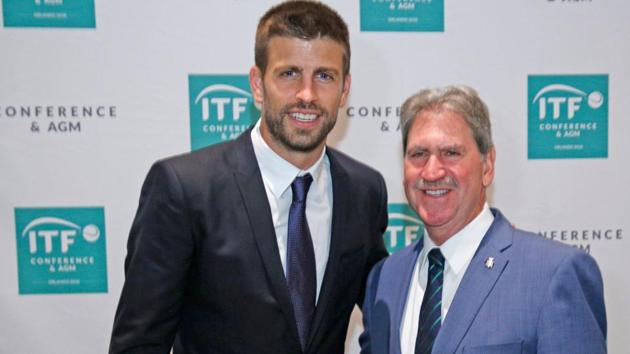 David Haggerty (R), President of the International Tennis Federation poses with with Gerard Pique, Founder of Kosmos sports group during the ITF annual general meeting in Orlando, Florida.(AFP)