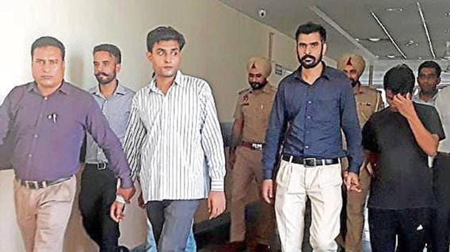 The accused in the custody of Punjab state cyber cell in Mohali. (HT Photo) The accused in the custody of Punjab state cyber cell in Mohali. (HT Photo)
