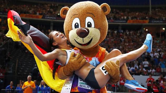 Germany’s Gesa-Felicitas Krause is lifted by mascot Berlino as she celebrates after winning the gold medal in the women’s 3000-meter steeplechase at the European Athletics Championships in the Olympic stadium in Berlin, Germany. (Matthias Schrader / AP) Germany’s Gesa-Felicitas Krause is lifted by mascot Berlino as she celebrates after winning the gold medal in the women’s 3000-meter steeplechase at the European Athletics Championships in the Olympic stadium in Berlin, Germany. (Matthias Schrader / AP)