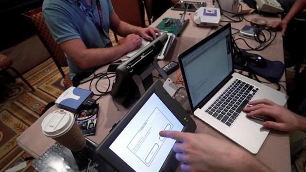 Hackers try to access and alter data from an electronic poll books in a Voting Machine Hacking Village during the Def Con hacker convention in Las Vegas, Nevada, US. (REUTERS File Photo) Hackers try to access and alter data from an electronic poll books in a Voting Machine Hacking Village during the Def Con hacker convention in Las Vegas, Nevada, US. (REUTERS File Photo)