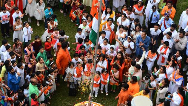 Members of Wagholi housing societies association celebrate their anniversary and the Independence Day on Wednesday. Both children and adults participated enthusiastically in the flag-hoisting ceremony and also sang the national anthem to celebrate the country’s independence.  (Shankar Narayan/HT PHOTO) 