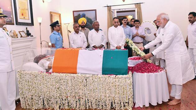 Prime Minister Narendra Modi (R) lays a wreath next to the body of former Prime Minister Atal Bihari Vajpayee in New Delhi. Three-time Prime Minister, Atal Bihari Vajpayee died August 16, sparking tributes from across the political spectrum as current leader Narendra Modi mourned the "irreplaceable loss" of the respected statesman. (PIB / AFP) Prime Minister Narendra Modi (R) lays a wreath next to the body of former Prime Minister Atal Bihari Vajpayee in New Delhi. Three-time Prime Minister, Atal Bihari Vajpayee died August 16, sparking tributes from across the political spectrum as current leader Narendra Modi mourned the "irreplaceable loss" of the respected statesman. (PIB / AFP)