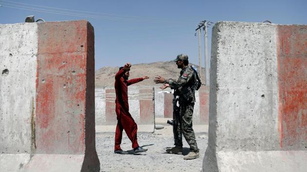 An Afghan National Army (ANA) soldier inspects a passenger at a checkpoint on the Ghazni - Kabul highway, Afghanistan. (Mohammad Ismail / REUTERS) An Afghan National Army (ANA) soldier inspects a passenger at a checkpoint on the Ghazni - Kabul highway, Afghanistan. (Mohammad Ismail / REUTERS)