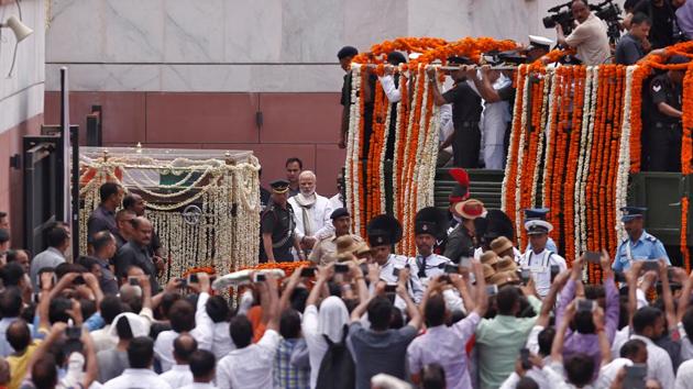 Prime Minister Narendra Modi walks along with Atal Bihari Vajpayee’s funeral procession in New Delhi.(REUTERS)