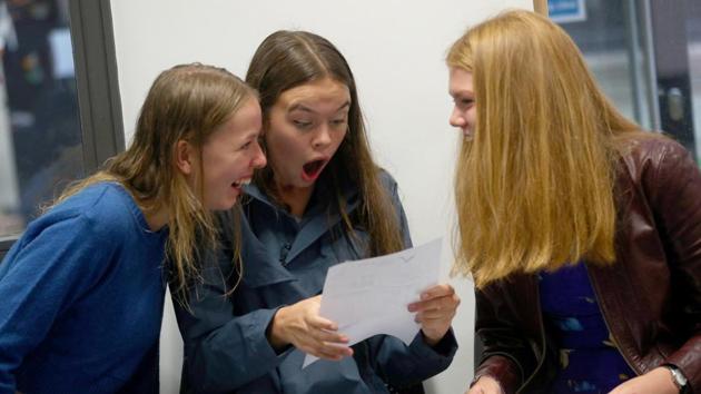 Students react as they receive their ‘A’ level results at Stoke Newington School and Sixth Form in London, England. (Hannah McKay / REUTERS) Students react as they receive their ‘A’ level results at Stoke Newington School and Sixth Form in London, England. (Hannah McKay / REUTERS)