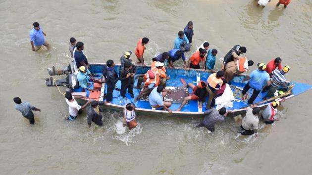 Rescuers in helicopters and boats fought through renewed torrential rain Saturday to reach stranded villages in Kerala. (Raj K Raj/HT Photo)