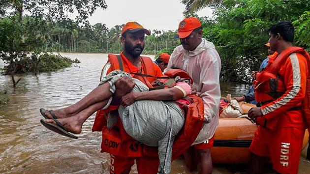 NDRF personnel rescue flood-hit people in Wayanad, Kerala on August 11.(PTI Photo)