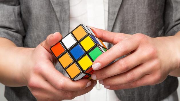 An 18-year-old student from Georgia solved six Rubik’s cubes under water in one breath on Friday, in a bid to set a new Guinness World Record.(Getty Images)