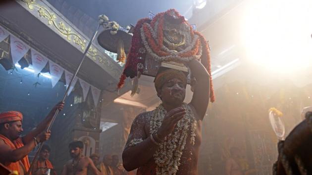 People celebrate Nag Panchami at Suvarna Temple, Powai in Mumbai, Mahrashtra. (Satyabrata Tripathy / HT Photo) 