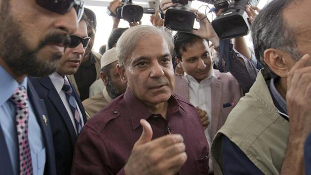 Pakistani opposition leader Shahbaz Sharif, center, arrives at the National Assembly in Islamabad, Pakistan, Friday.(AP Photo)