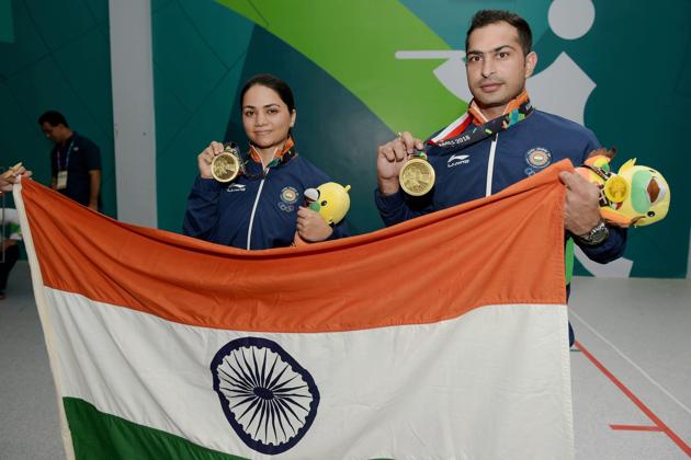 Palembang: Indian shooters Ravi Kumar and Apurvi Singh Chandela celebrate after winning the bronze medal in the Final 10m Air Rifle Mix Team event during the 18th Asian Games Jakarta Palembang, in Indonesia on Sunday, Aug 19, 2018. (PTI Photo/Vijay Verma) (PTI8_19_2018_000049B) (PTI)
