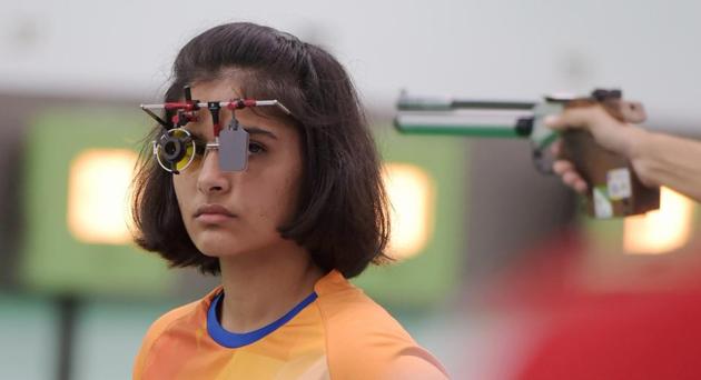 Indian shooter Manu Bhaker competes in the 10m air pistol qualification round in Palembang on Sunday.(PTI)