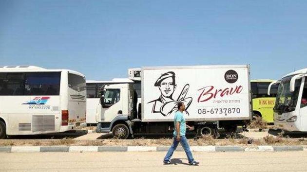 A Palestinian man walks past vehicles upon arrival at Erez crossing between Israel and northern Gaza Strip.(Reuters File Photo) A Palestinian man walks past vehicles upon arrival at Erez crossing between Israel and northern Gaza Strip.(Reuters File Photo)