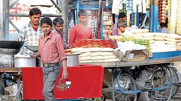 The civic body charges a composition fee for allotting space to street vendors on roadsides.(HT Photo)