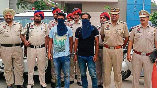 Accused in police custody in SBS Nagar on Saturday (HT Photo) Accused in police custody in SBS Nagar on Saturday (HT Photo)