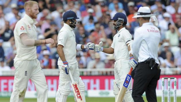 Indian cricket captain Virat Kohli, second left, and Ajinkya Rahane encourage each other. (AP)