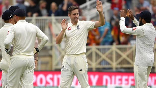England's Chris Woakes (C) celebrates with teammates after taking the wicket of India's Shikhar Dhawan for 35. (AFP)