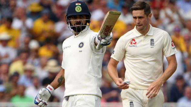 India's captain Virat Kohli (L) celebrates reaching his half century. (AFP)