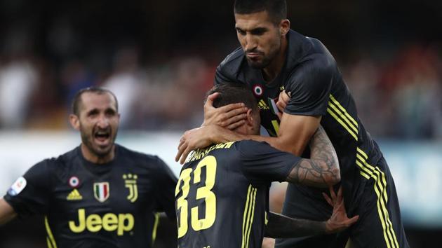 Juventus footballers celebrate during their Serie A encounter against Chievo.(AFP)