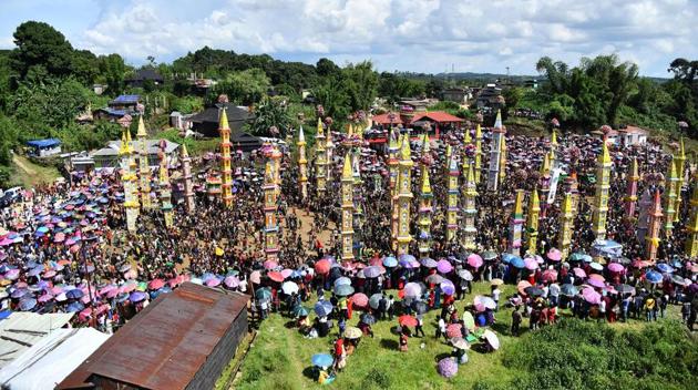 Tribesmen carry traditional chariots to mark the Behdienkhlam festival in Tuber village in Meghalaya on July 19, 2018. The festival is celebrated after sowing crops and prays for a good harvest.(AFP)