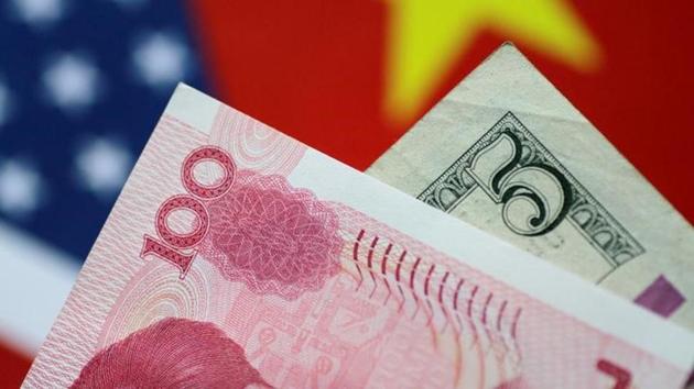 US dollar and China Yuan notes. Trade talks between China and the US, movement of Turkish lira and rupee would take centre stage this week and dictate the trend in the equity markets, say experts.(Reuters File Photo)