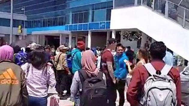 People evacuate from Lombok International Airport after an earthquake in this still image obtained from a social media video August 19, 2018. (Reuters Photo via Fahad Attamimi)