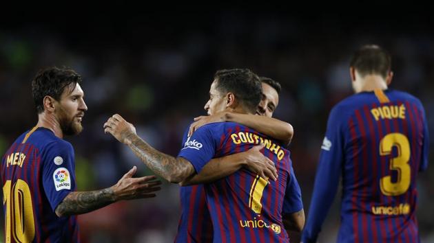 FC Barcelona's Coutinho, front center, celebrates with teammates, including Lionel Messi, left, during a Spanish La Liga soccer match against Alaves at Camp Nou.(AP)