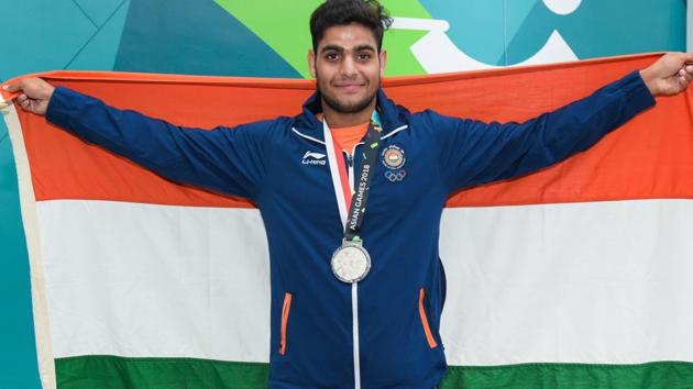 Silver medallist India's Lakshay Sheoran poses for photographs at the award ceremony of men's trap shooting event. (PTI) Silver medallist India's Lakshay Sheoran poses for photographs at the award ceremony of men's trap shooting event. (PTI)