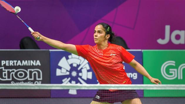 Jakarta: Indian shuttler Saina Nehwal in action against Japan player Nozomi Okuhara (unseen) at Women's Team quarterfinals event during the 18th Asian Games. (PTI) Jakarta: Indian shuttler Saina Nehwal in action against Japan player Nozomi Okuhara (unseen) at Women's Team quarterfinals event during the 18th Asian Games. (PTI)