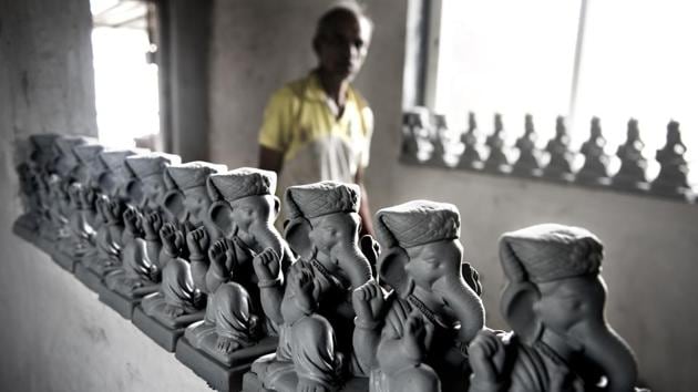 Assembled Ganesha idols sit out to dry. “When my father started making Ganpati idols, his idea was to make eco-friendly and harmless idols and those which may dissolve in water instantly. He never used toxic colours and Plaster or Paris in his idols,” Hazare said, recalling his father’s golden rules. (Satish Bate / HT Photo) Assembled Ganesha idols sit out to dry. “When my father started making Ganpati idols, his idea was to make eco-friendly and harmless idols and those which may dissolve in water instantly. He never used toxic colours and Plaster or Paris in his idols,” Hazare said, recalling his father’s golden rules. (Satish Bate / HT Photo)