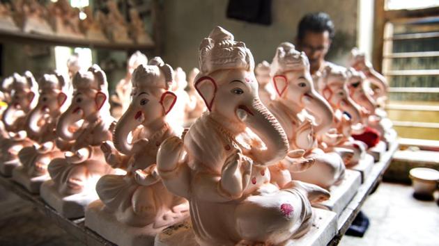 Ganesha statues mid-completion are seen at the Hazare family workshop. The family makes and sells about 1,000 clay idols of the god every year and has witnessed rising demand for the all-natural pieces over the years as awareness of the environmental costs of PoP based idols has risen among consumers. (Satish Bate / HT Photo) 