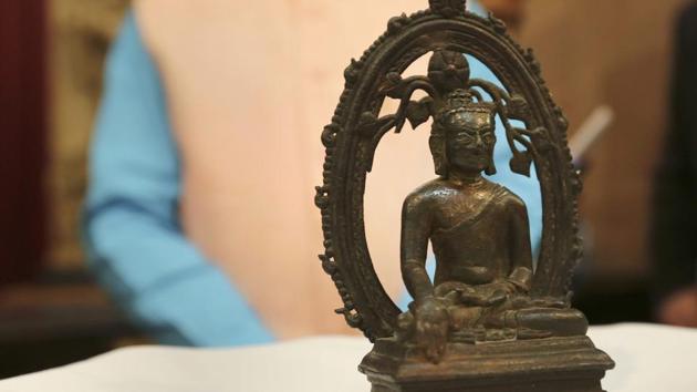 The ancient Buddha statue displayed at the High Commission of India in London Wednesday, Aug. 15, 2018, during a ceremony to hand it back to India, 57-years after it was stolen from an Indian museum and found its way to UK's art dealer market. Police returned the 12-century bronze Buddha statue during a ceremony Wednesday in London marking India's Independence Day.(AP)