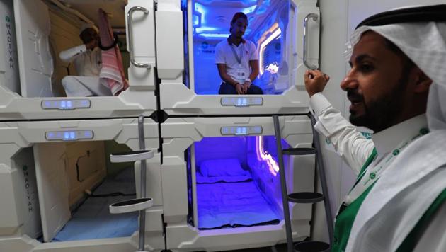 Saudi men are pictured inside sleep pods in Mecca on August 16, 2018. The free nap pods are part of new measures Saudi Arabia is rolling out this year in a bid to modernise the centuries-old practice of hajj. This year, the Saudis have also launched a “smart hajj” initiative, with apps to help pilgrims with everything from travel plans to medical care. (Ahmad Al-Rubaye / AFP)